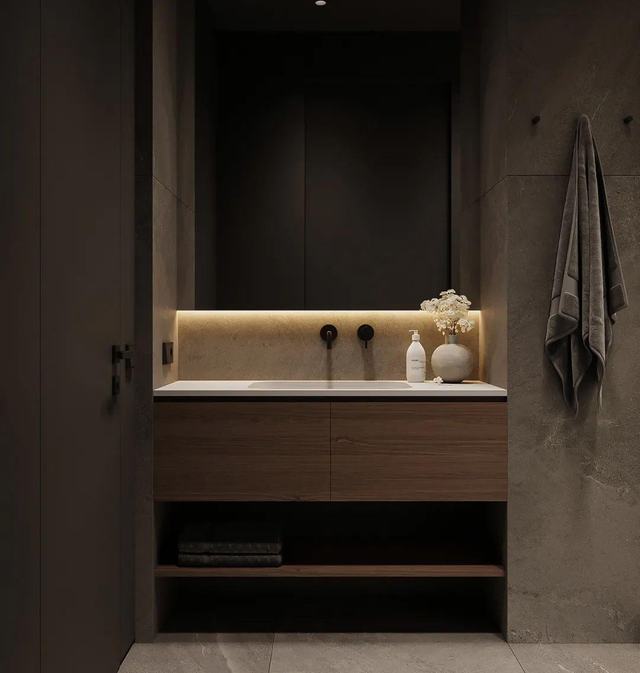 Walnut vanity in a lit niche